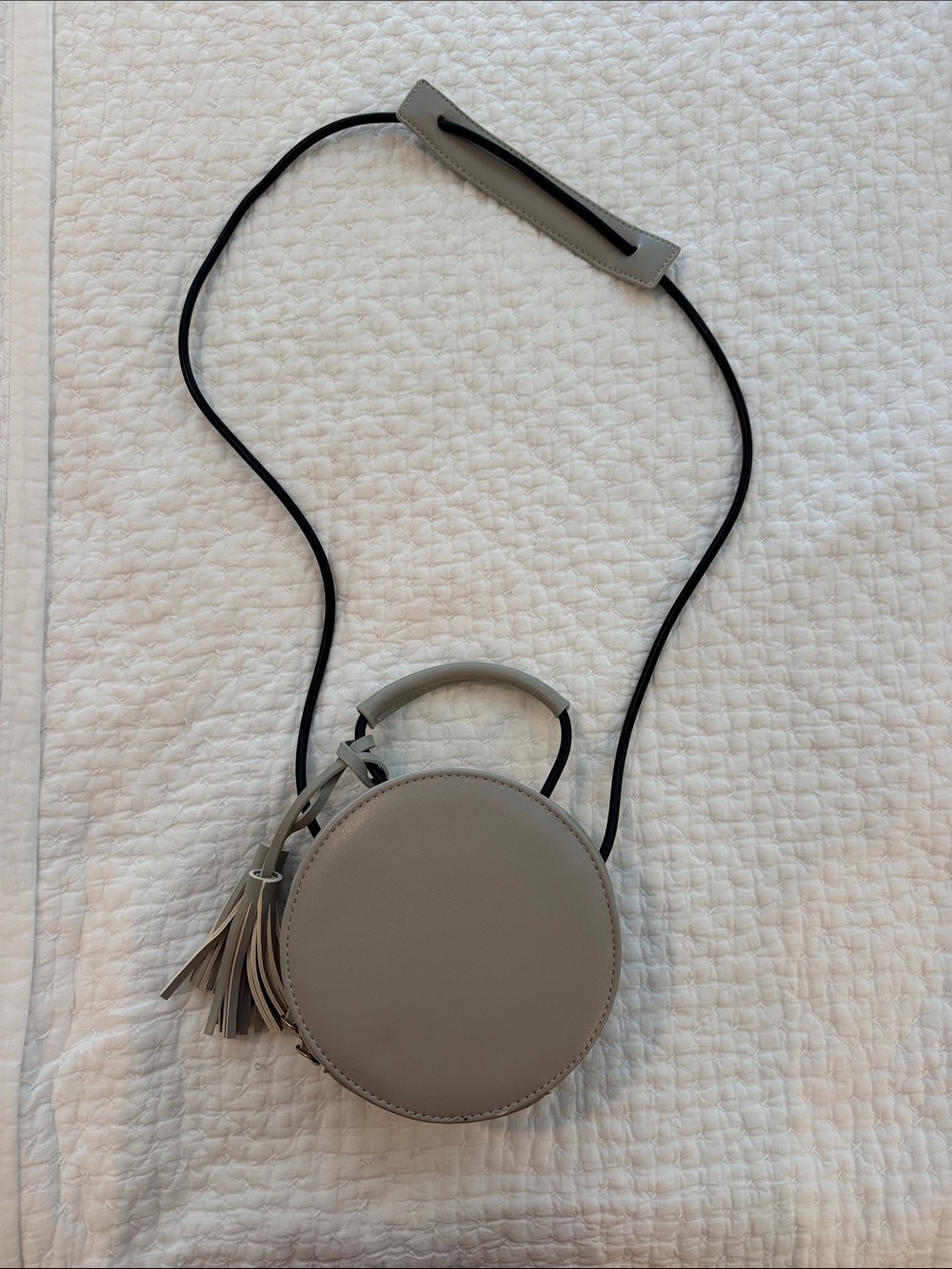 Women's Round Gray Crossbody Bag with Tassel Accent